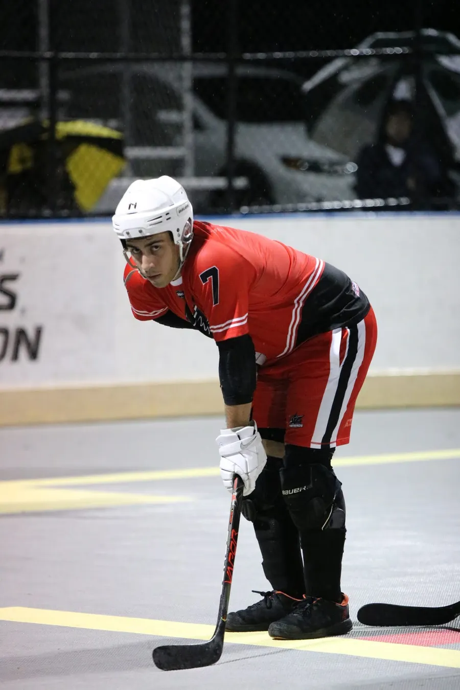 Mark in the red Mon Valley Warbirds jersey, number 7, leaning on his stick between plays.